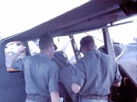 Don Withrow and one of our three pilots, a Lieutenant whose name I can't remember, planning a flight.